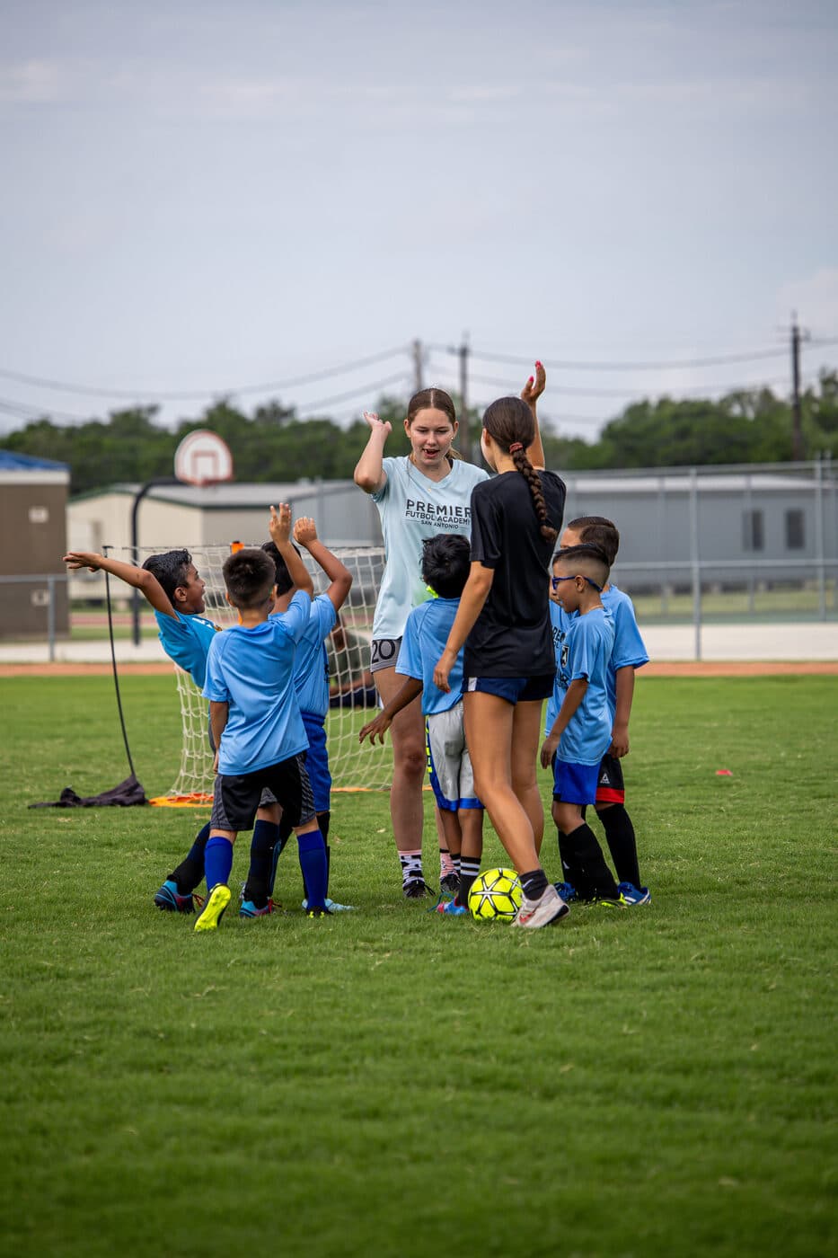 PFA coaches with young players